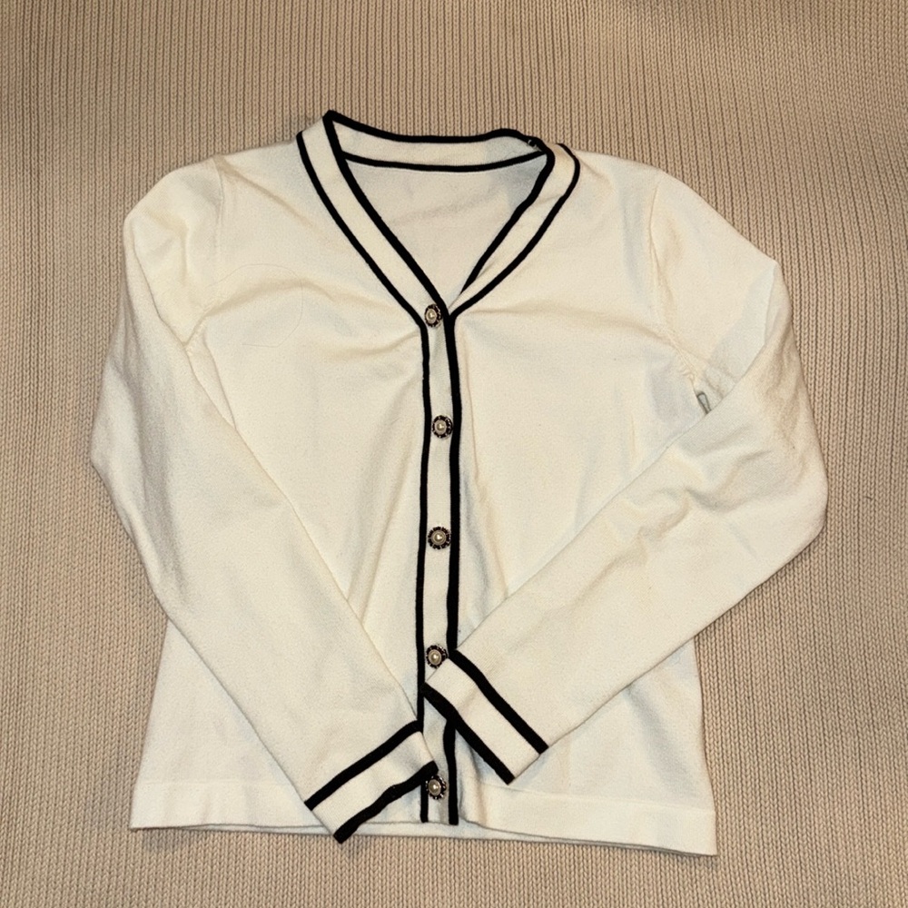 Dazy White Sweater With Black Trim And Ornate Buttons